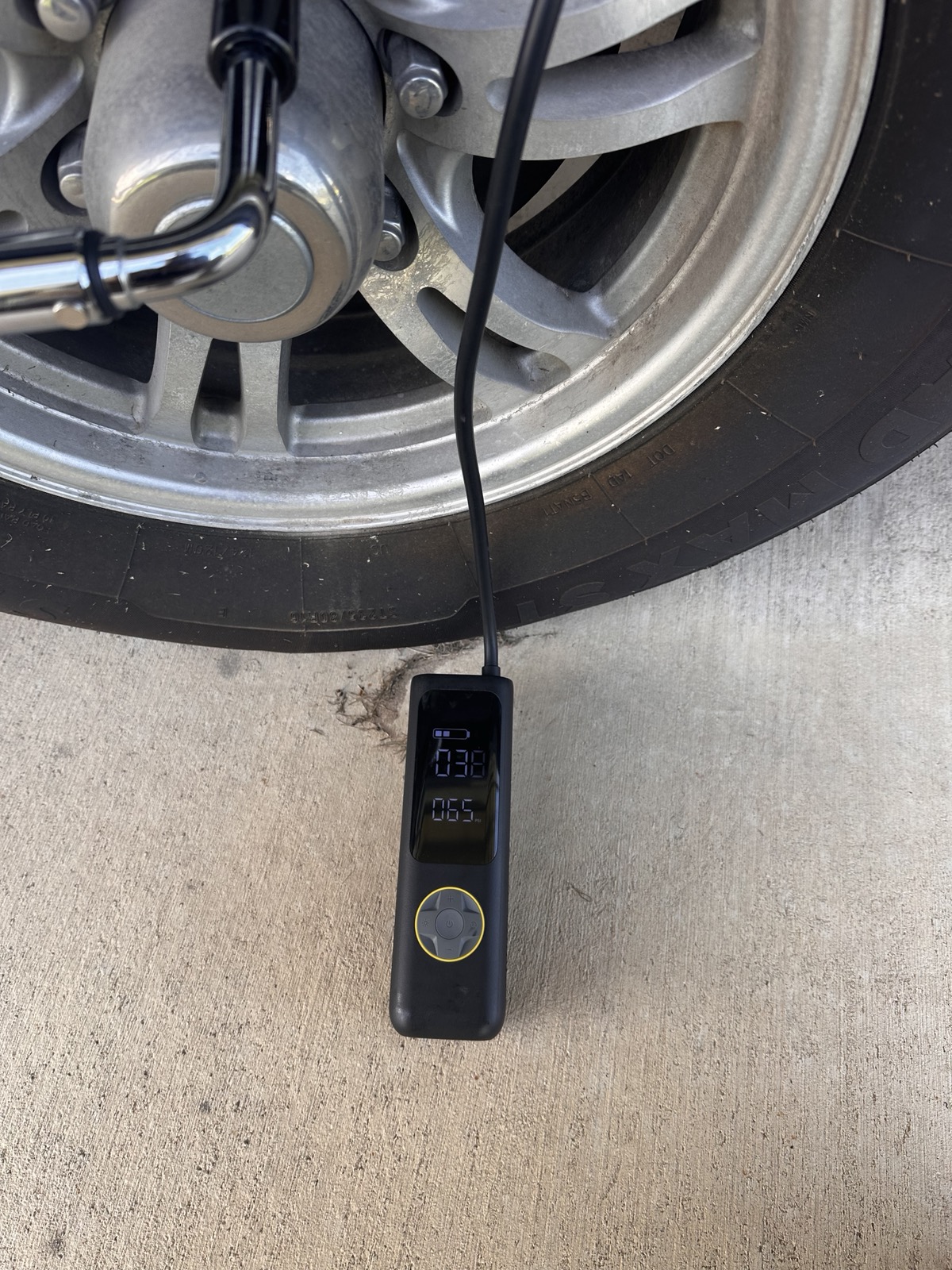 Digital tire gauge reading 38 PSI on a trailer tire spec'd for 65 PSI — found at pre-trip inspection