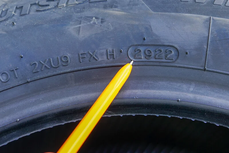 RV tire sidewall DOT date code close-up showing the week and year the tire was manufactured