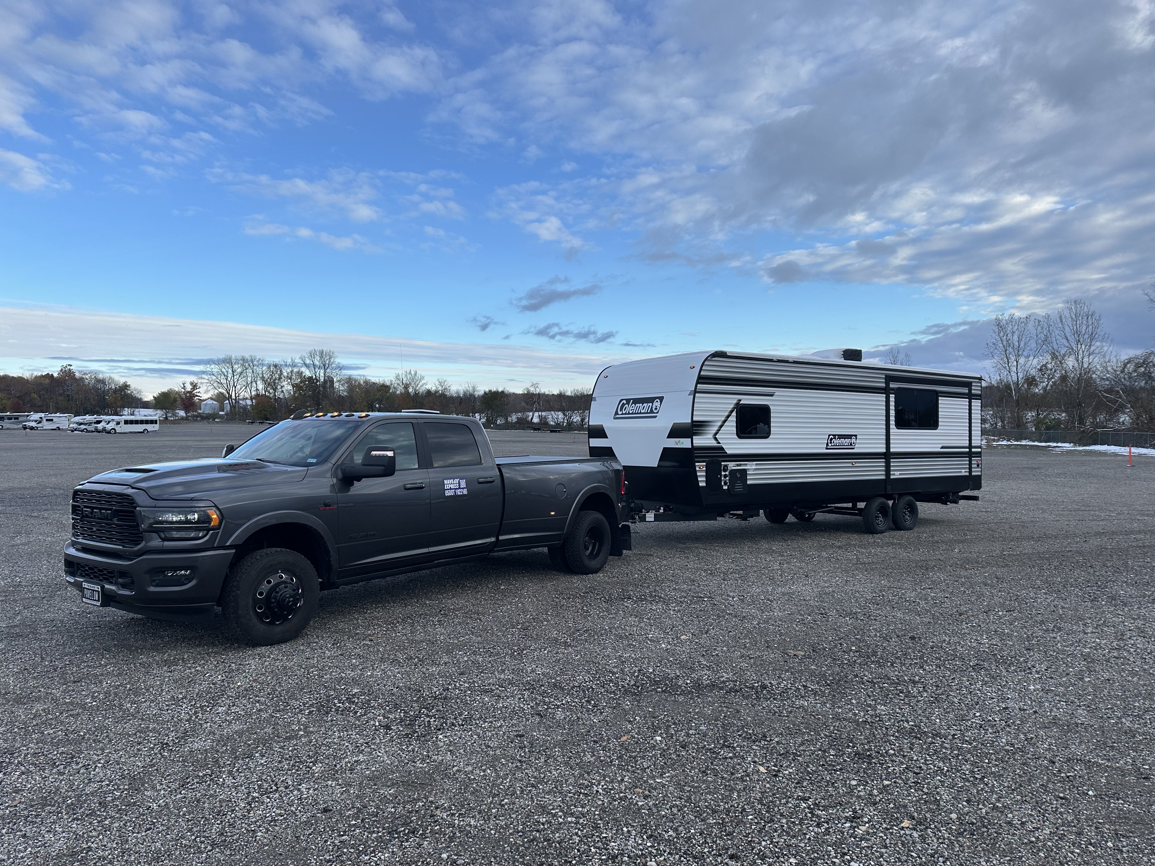 Coleman travel trailer picked up for transport