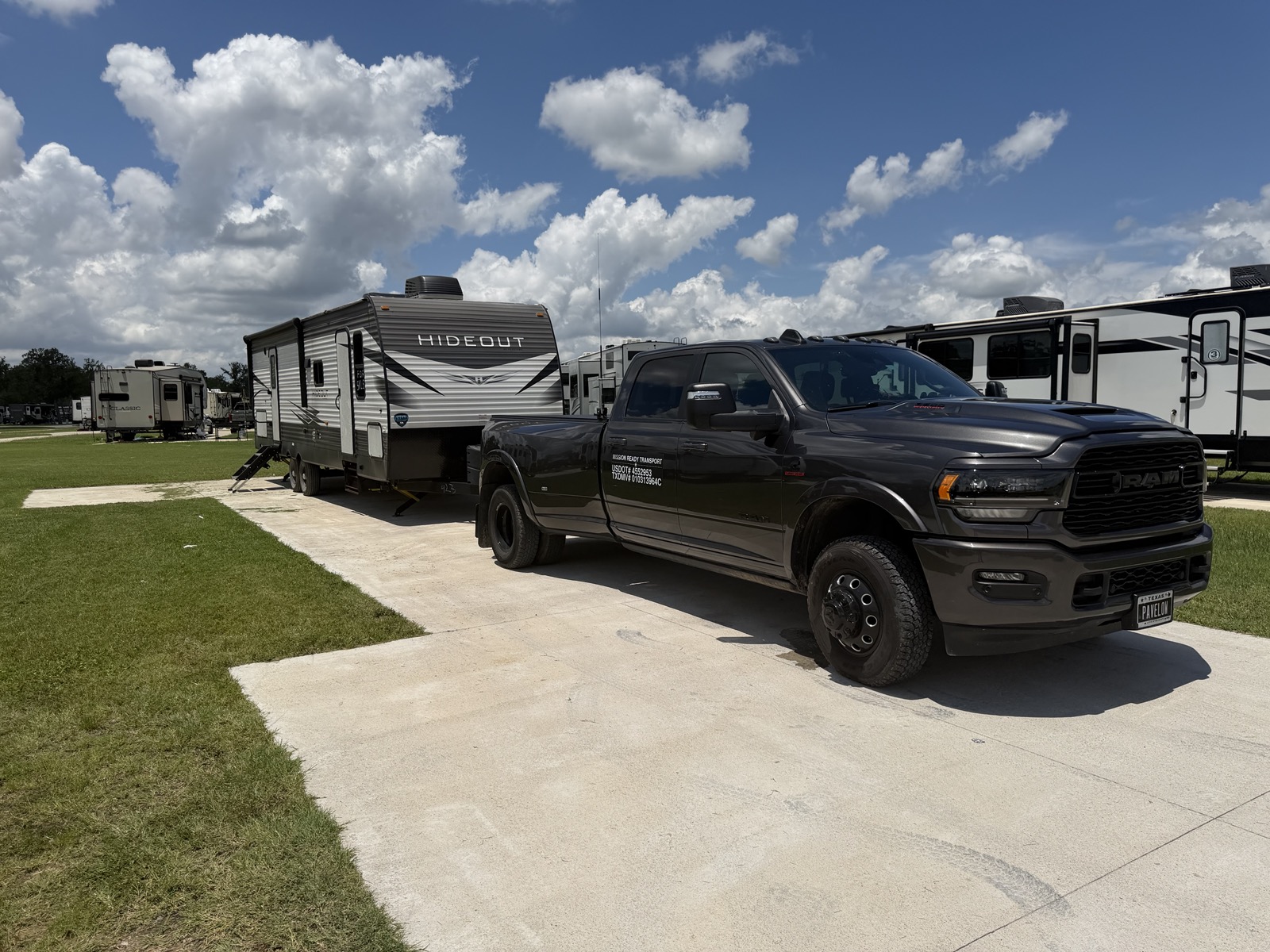 Mission Ready Transport truck with Keystone Hideout travel trailer at an RV park