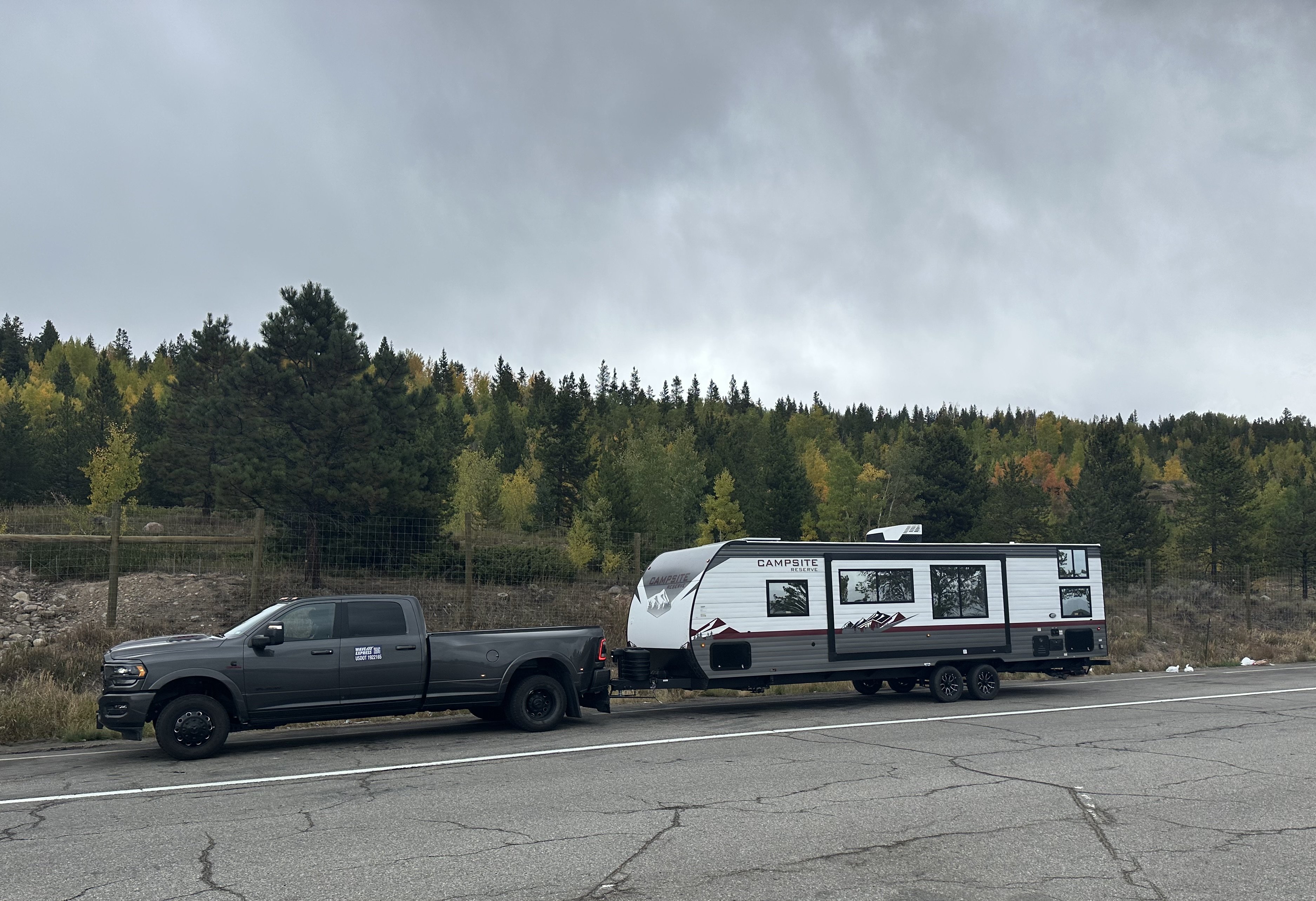 Mission Ready Transport Ram 3500 towing a Campsite Reserve travel trailer during an RV transport job