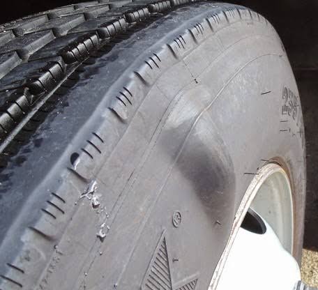 Sidewall bulge on an RV tire indicating compromised internal structure